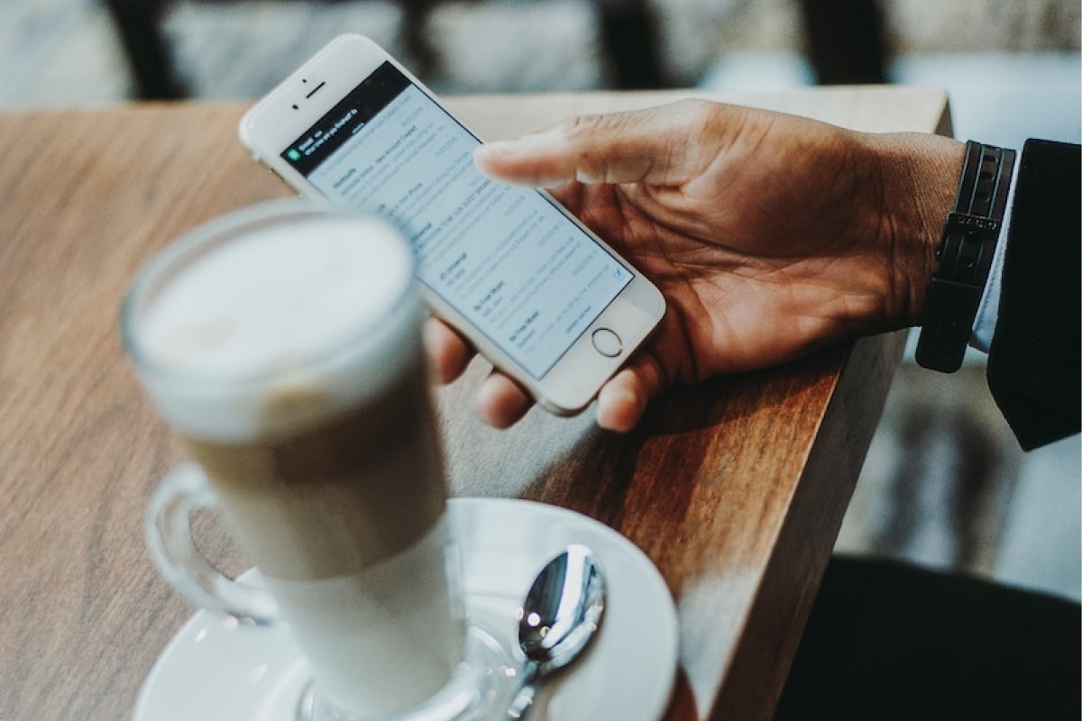 Man on his phone at a coffee shop