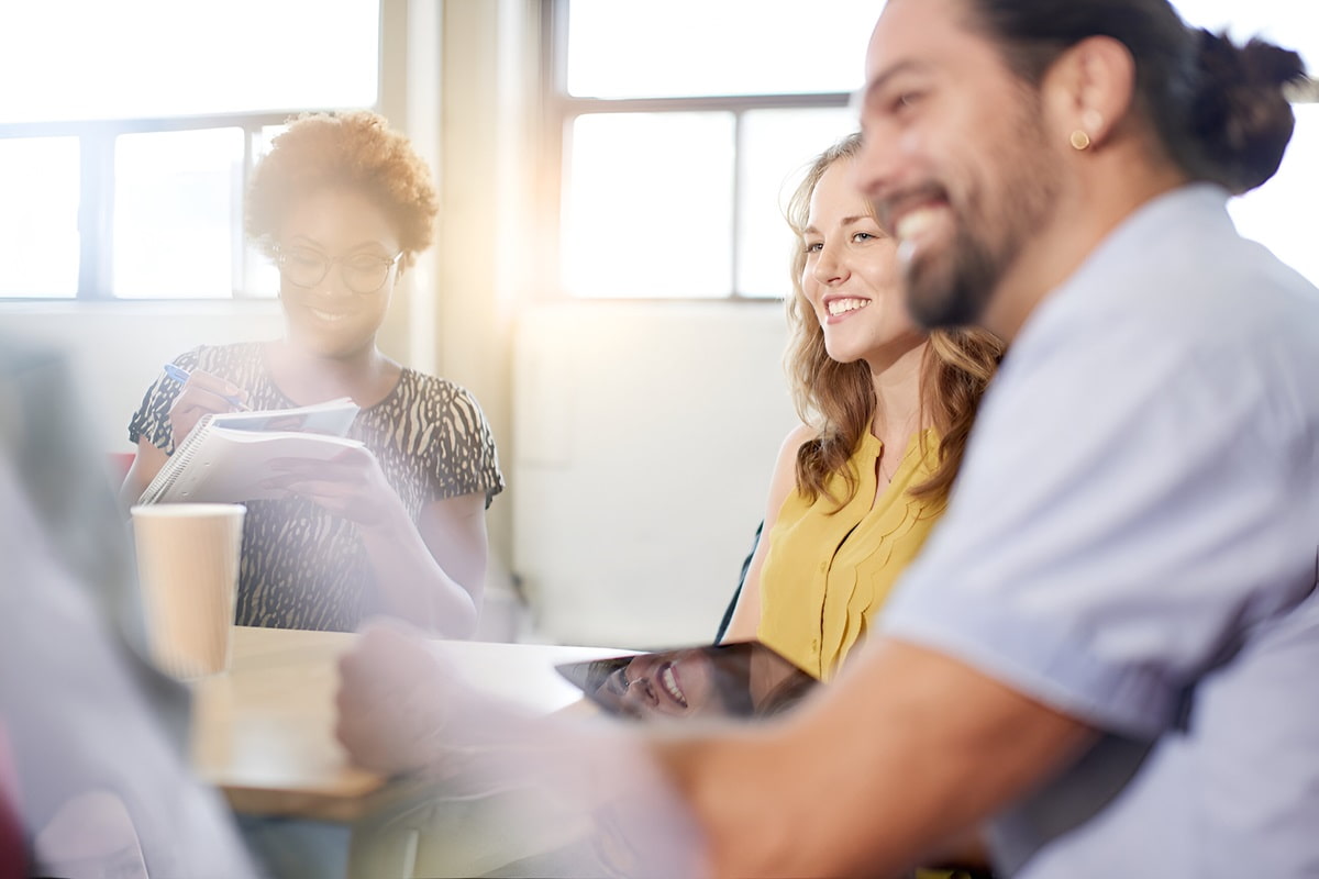 diverse company employees chatting and smiling